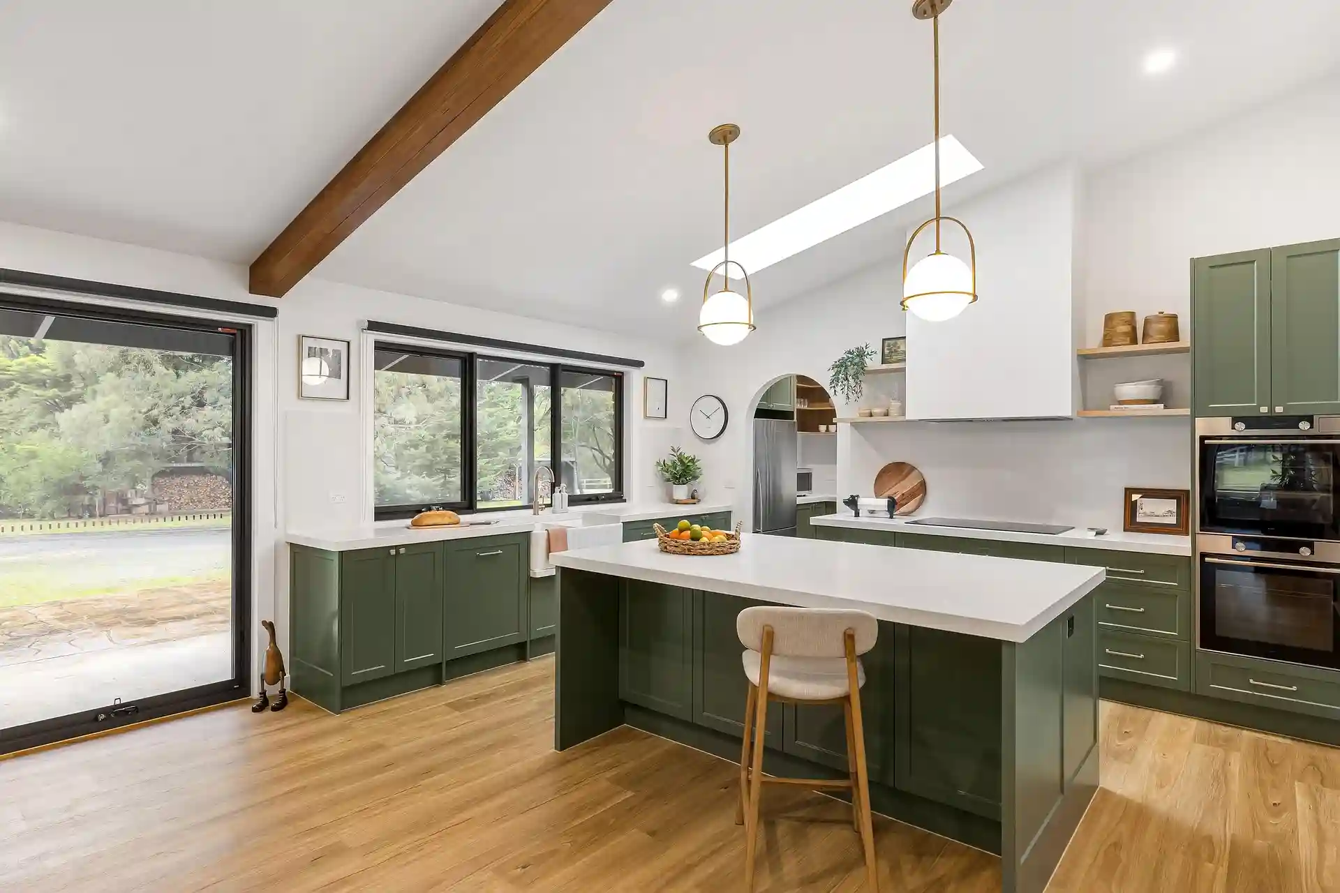 Custom kitchen millwork and stone island crafted by Reno Mumu