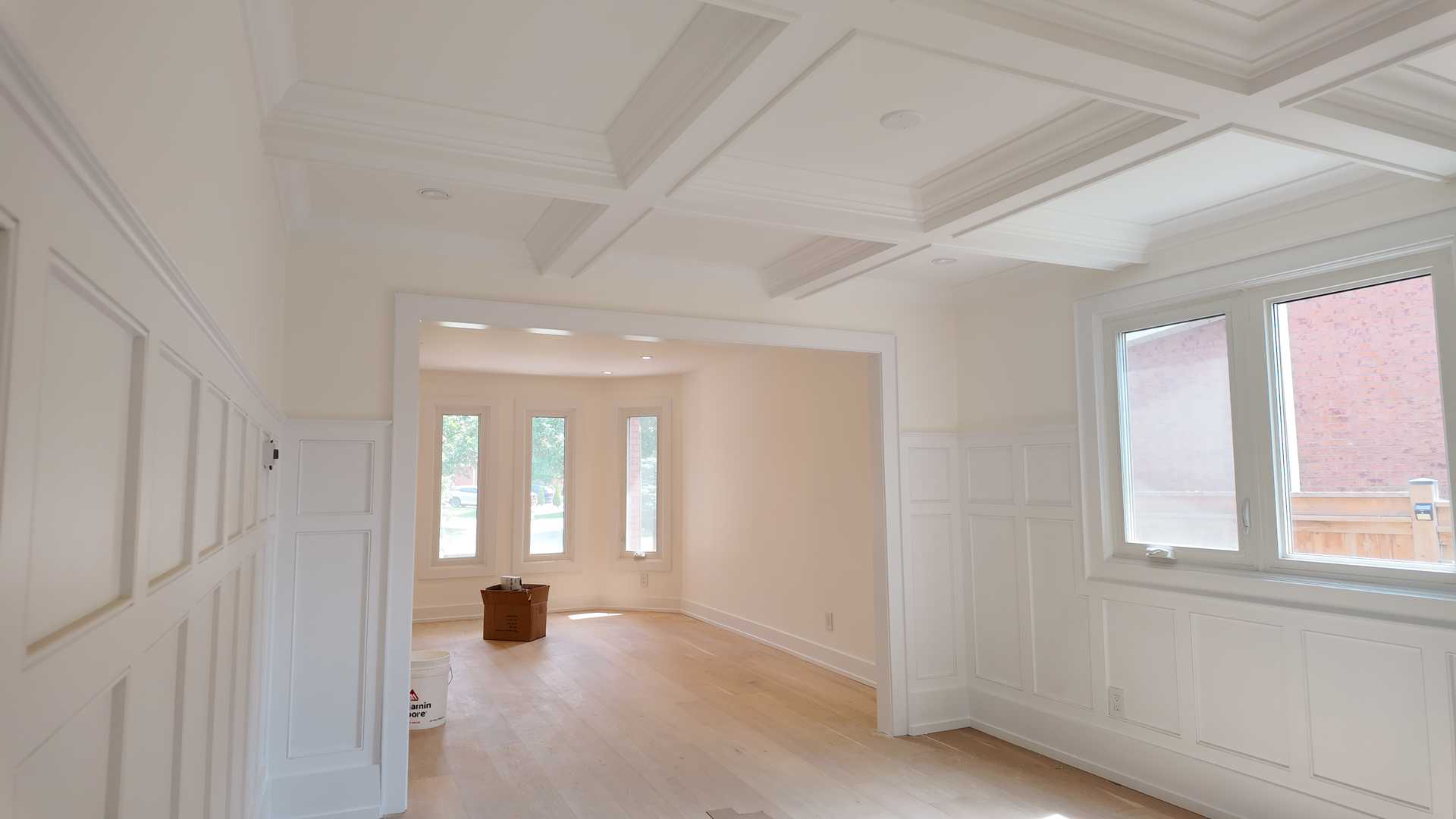 Waffle ceiling matching the square trim wall, brick accent TV