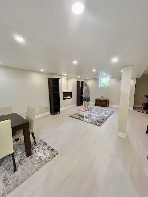 Grey vinyl flooring with white spray painting MDF wall unit
