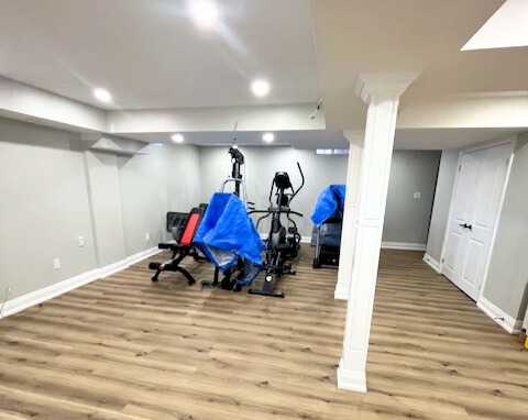 Grey vinyl flooring with built in tv wall, wet bar,