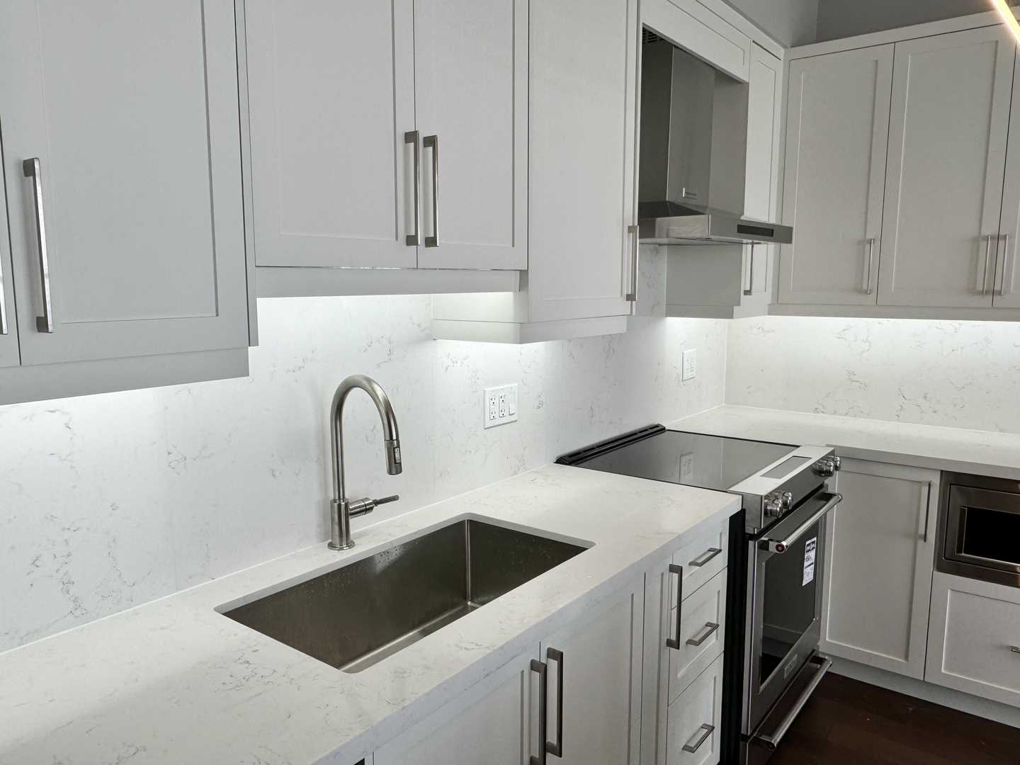 2 bathroom with white shaker kitchen cabinet